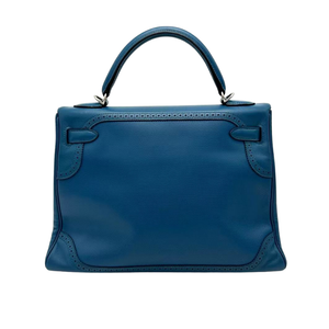 Pre-Owned Hermès Kelly 32 Ghillies in Turquoise a rare limited edition that features distinctive decorative brogue detailing SZ3062512161419