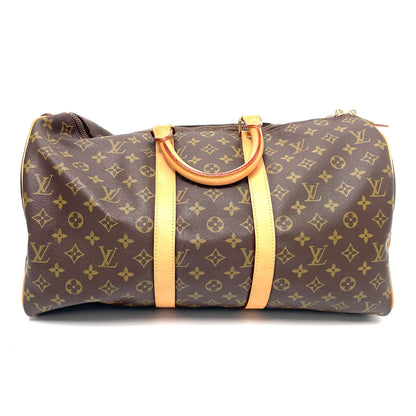 Pre-Owned Louis Vuitton Monogram Keepall 45 Bandoulière (Handheld), a vintage 1985 travel duffle bag with luggage tag and iconic Vachetta leather N24696062