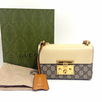Pre-Owned Gucci Padlock Medium Shoulder Bag in GG Supreme Canvas with Cream Leather Flap, a 2022 classic chain bag with original packaging N24712471