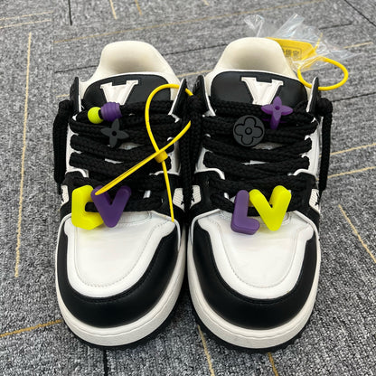 Pre-Owned Louis Vuitton Trainer Maxi Sneaker in Black & White, a chunky statement sneaker with vibrant lace accessories and oversized sole N24728561