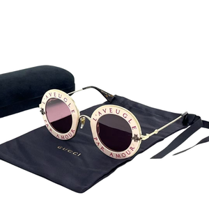 Pre-Owned Gucci GG0113S "L'Aveugle Par Amour" round-frame sunglasses SZ3042601010059