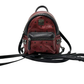 Pre-Owned MCM Mini Backpack in the red and black color-block SZ3022606101839