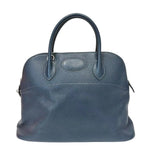 Blue leather handbag on a white background