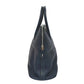 Navy blue handbag with a zipper on a white background