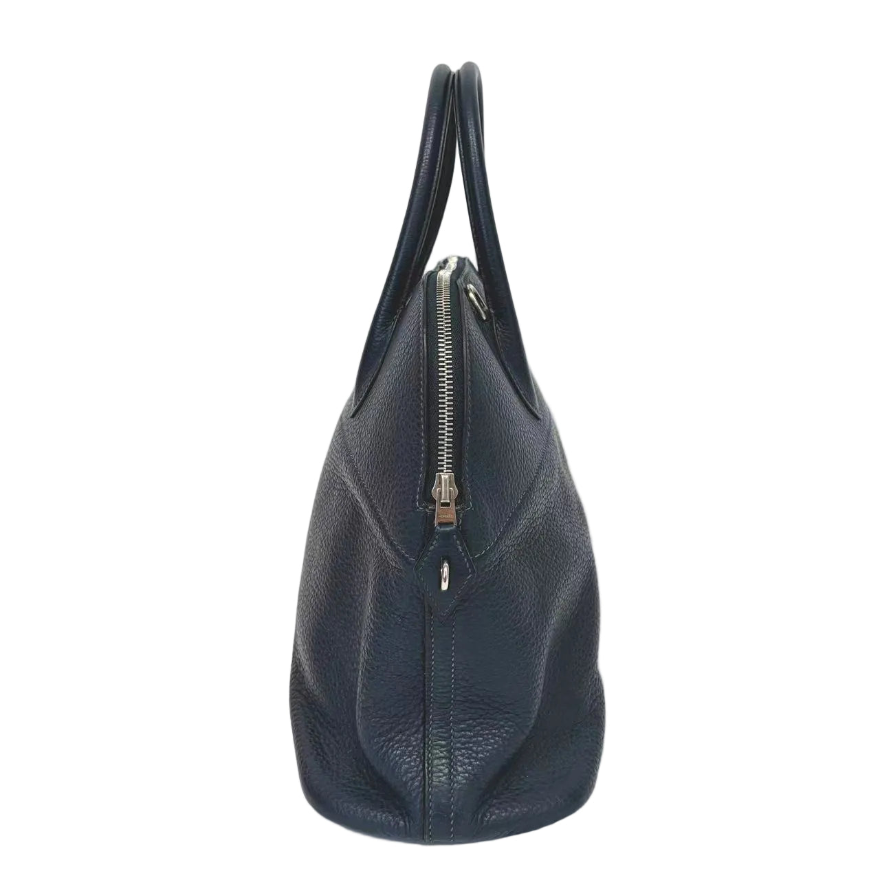 Navy blue handbag with a zipper on a white background