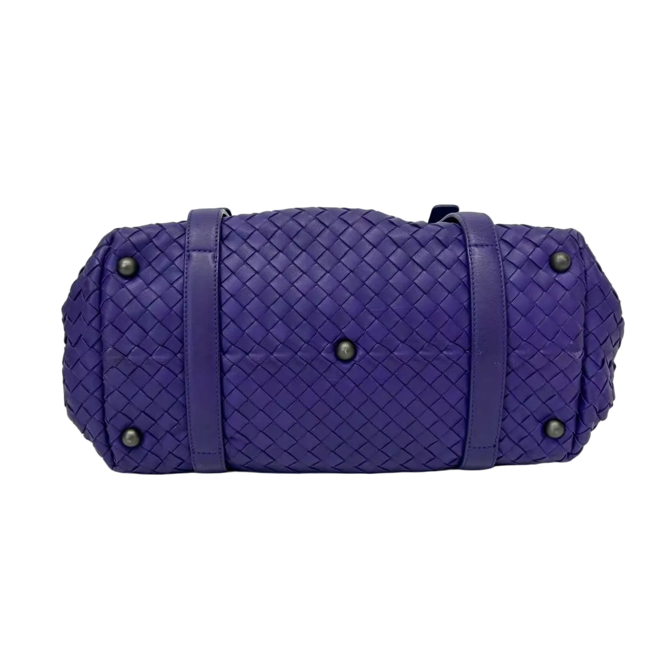 Purple woven handbag on a white background