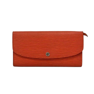 Orange textured clutch bag with a silver button on a white background
