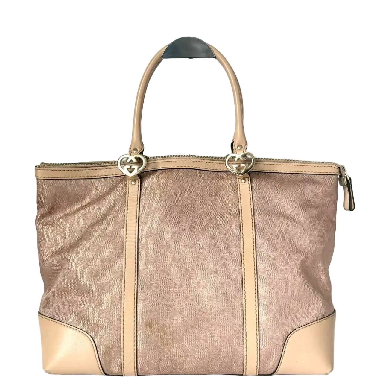 Brown handbag with beige accents on a white background