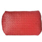 Red woven clutch bag on a white background