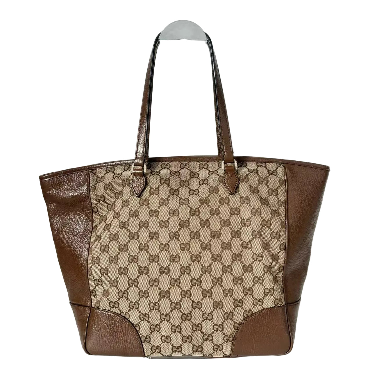 Brown and beige patterned tote bag on a white background