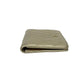 Quilted beige wallet on a white background