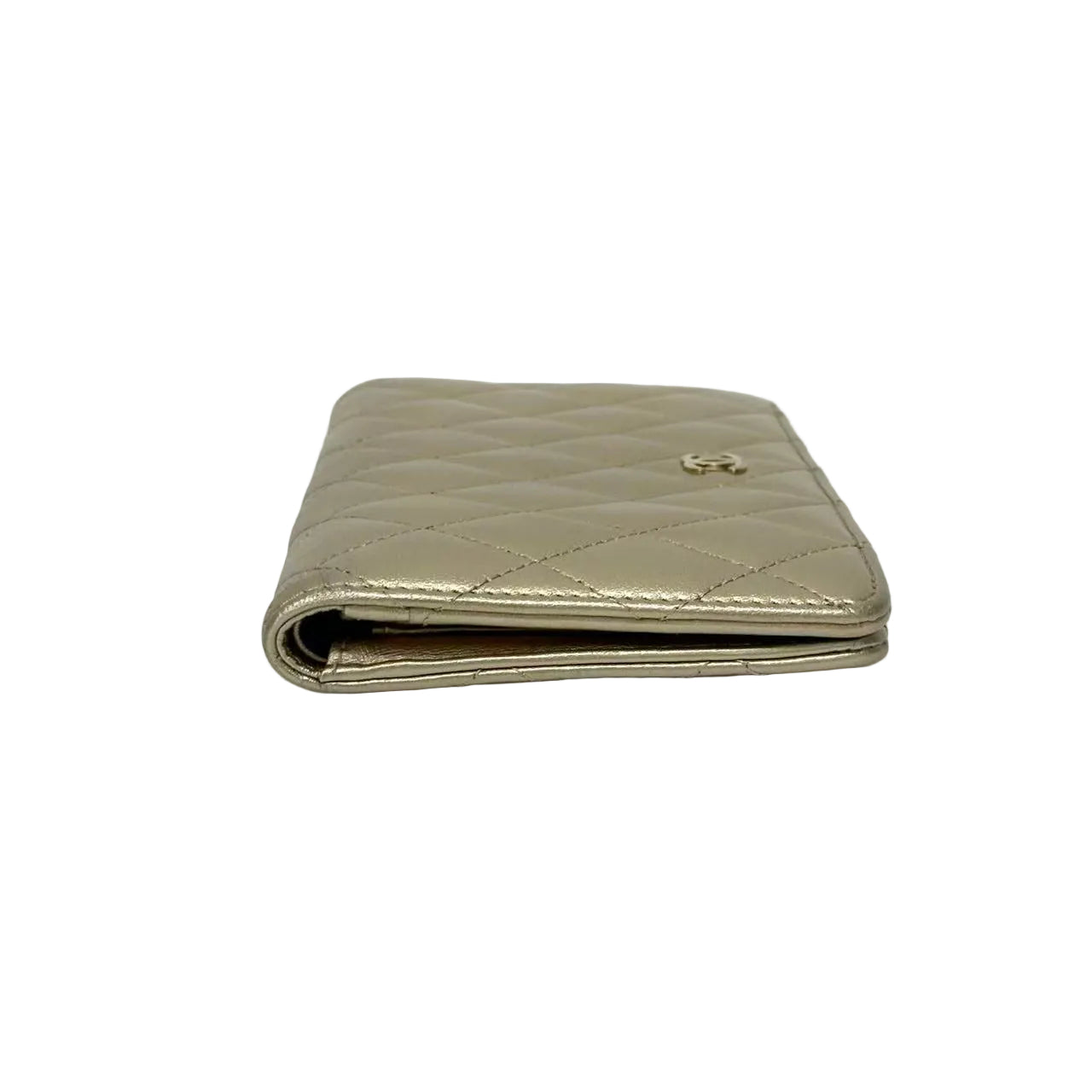 Quilted beige wallet on a white background