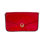 Red handbag with a gold clasp on a white background