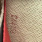 Pre-Owned Louis Vuitton Epi Emilie Wallet in the color Coquelicot red