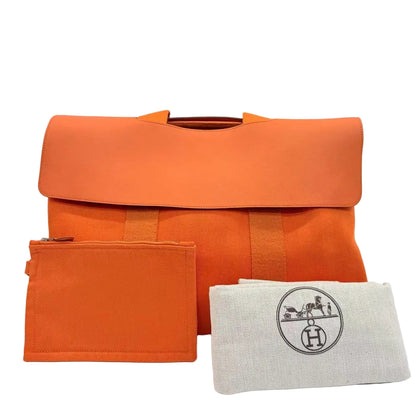 Orange fabric bag and pouch with a white pouch featuring a logo on a light gray background