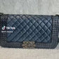 Pre-Owned Chanel Classic Double Flap (also known as the Timeless Classic) in black WWL2799/2599